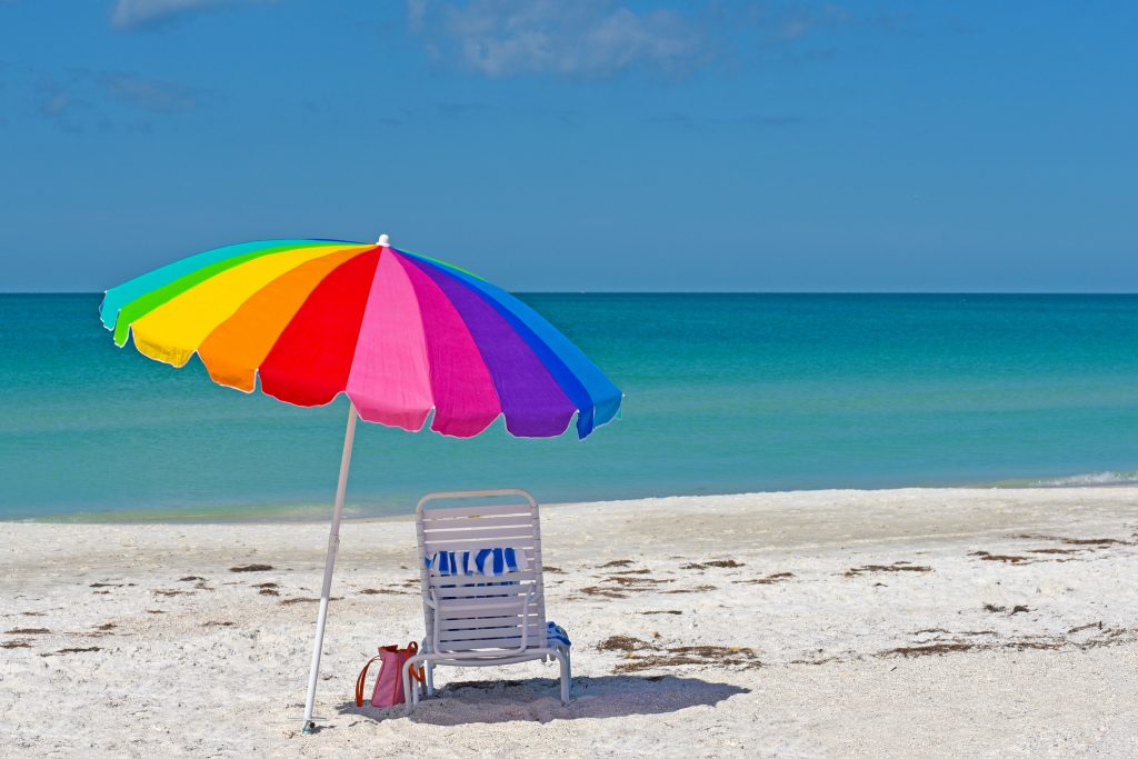 Colorful Umbrella and Chair on the Sandy Beaches of Anna Maria Island