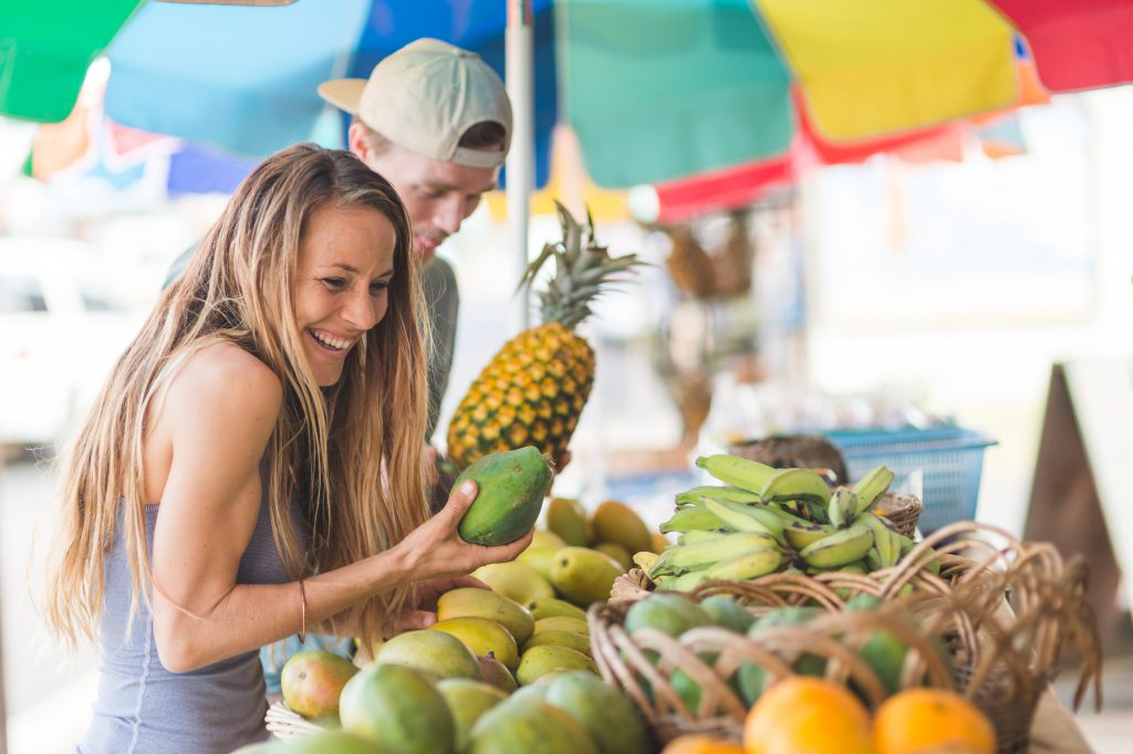 Young couple laughs and enjoys each other's company at the local farmers' market