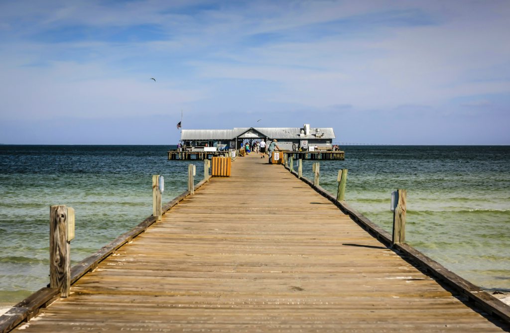 Anna Maria Island, FL, USA – December 20, 2012: The historic City Pier and restaurant stretching out into Tampa Bay on the Gulf of Mexico in Florida