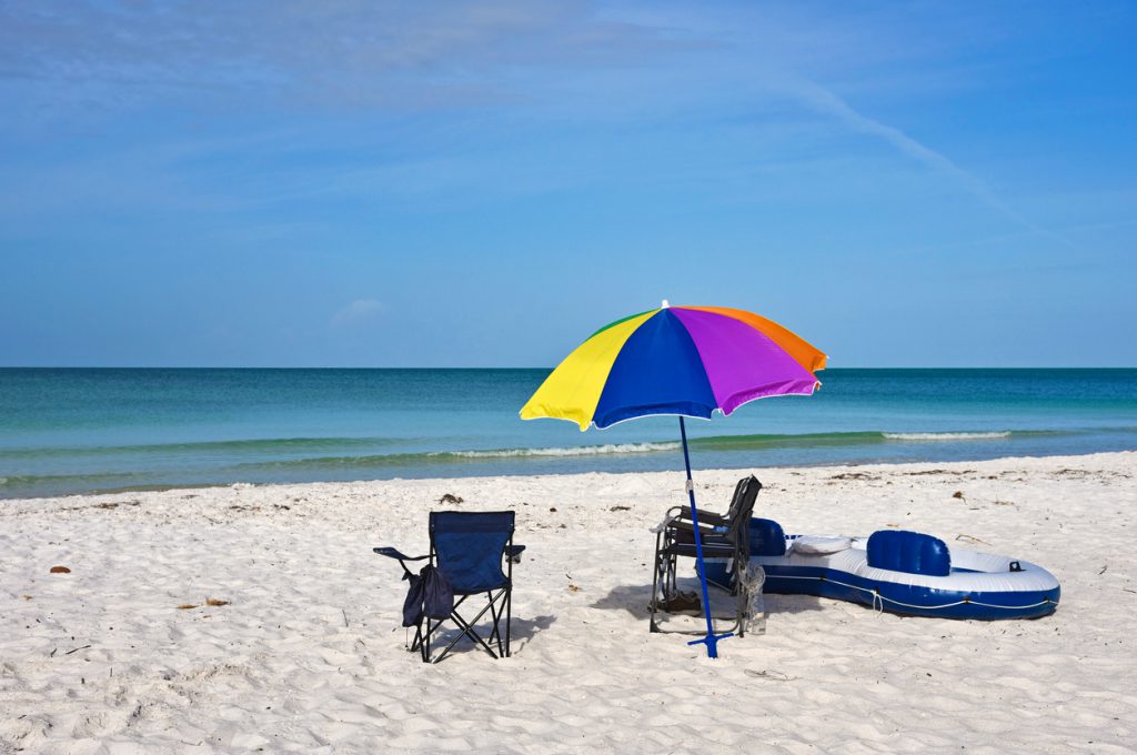 Beach Chairs with Umbrella and Raft on the Beach of Anna Maria Island, Florida